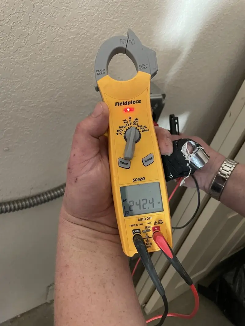Voltage testing with clamp meter during Generator Installation in Elm Grove